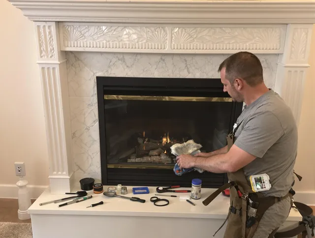 Rockland Chimney Sweep performing fireplace maintenance in Rockland, MA